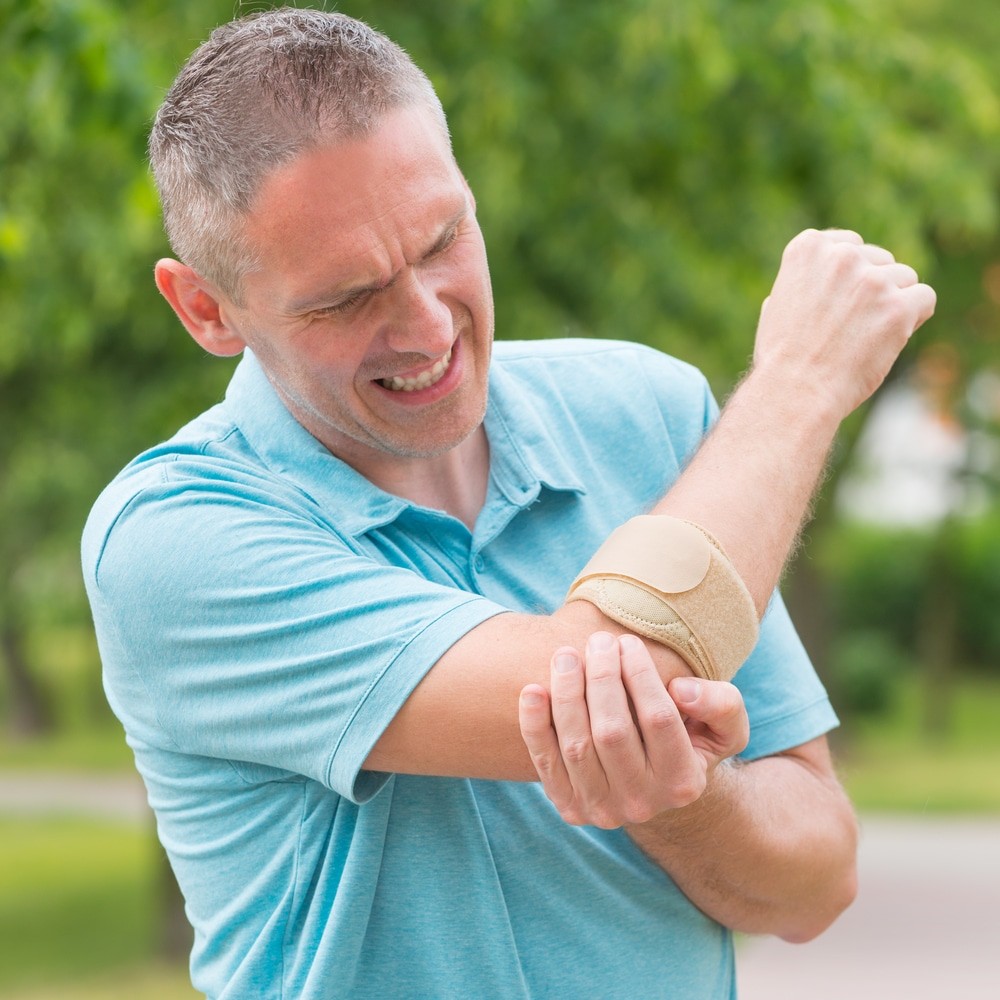 guy with tennis elbow pain for blog amazing life chiropractic and wellness in mill creek