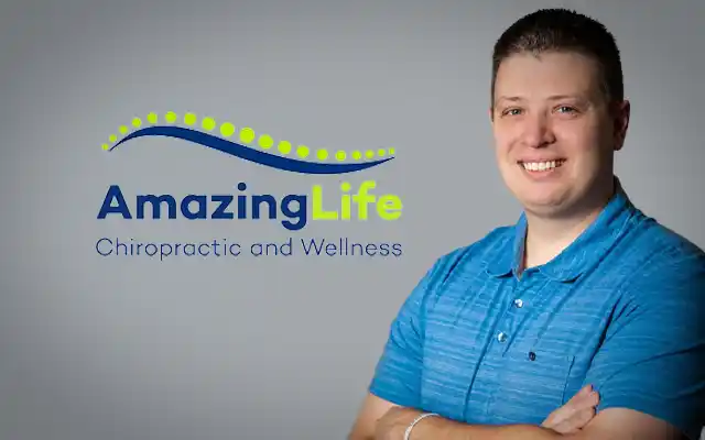 image of Dr. Sergey smiling with his arms crossed next to the Amazing Life Chiropractic and Wellness logo